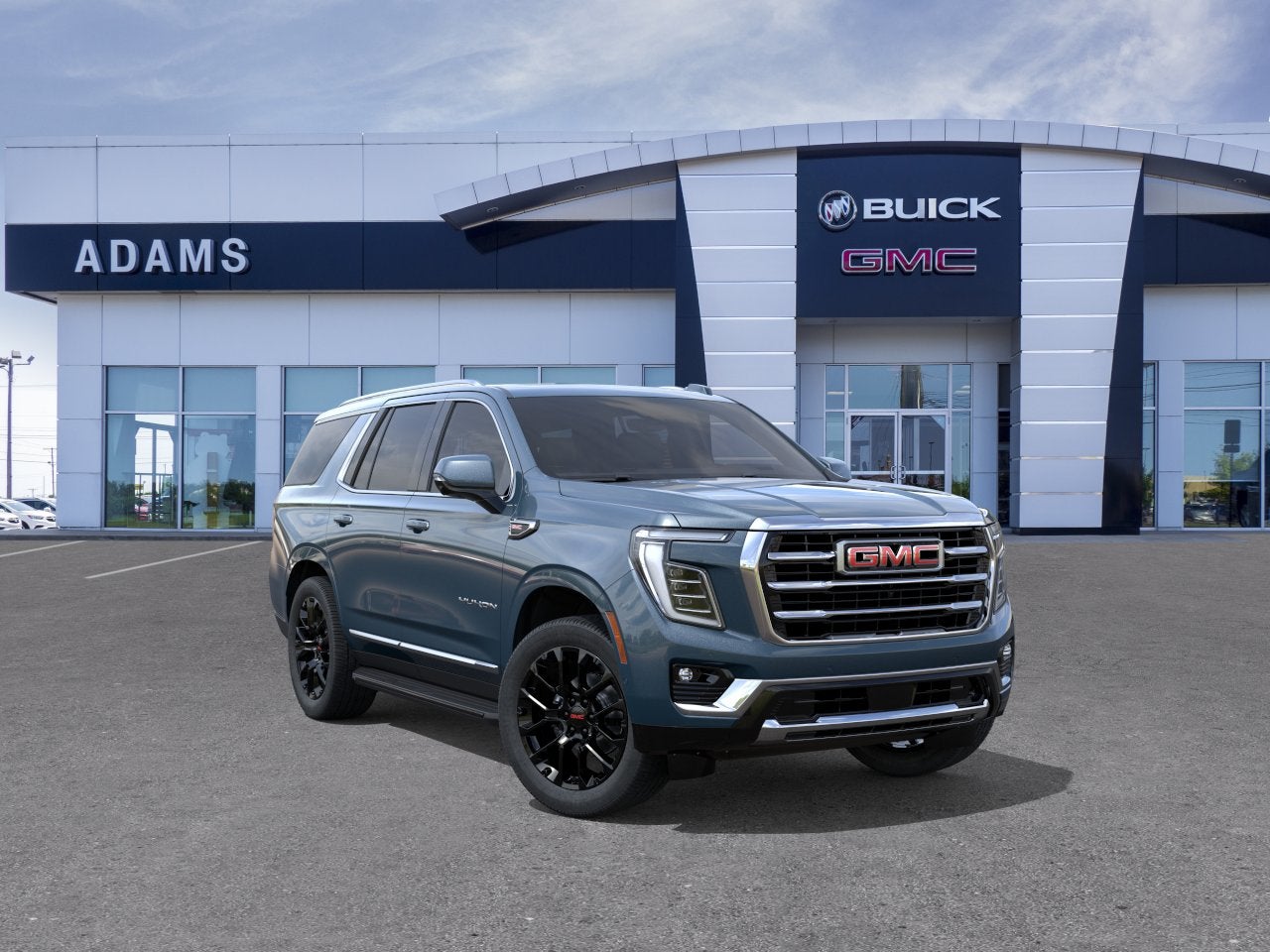 2026 GMC Yukon Elevation in Downpour Metallic — front three-quarter view