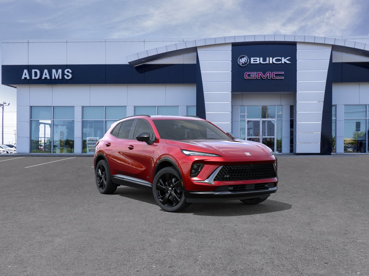 2026 Buick Envision Sport Touring in Brilliant Red — front three-quarter view